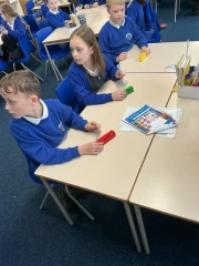 Year 4 Glow-Worms Music lesson with children usin red yellow and green chime bars