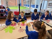 Sinfield Reward Day  children doing crafts and creating plants and flowers from paper and decorating plant pots