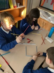 Year 6 Children making 3D cubes in DT  with joins