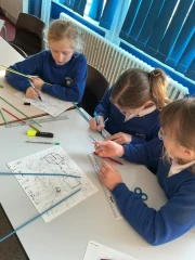 Year 6 Children making 3D cubes in DT