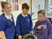 Year 6 children using a stethoscope