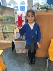 Year One child showing a hand puppet she made