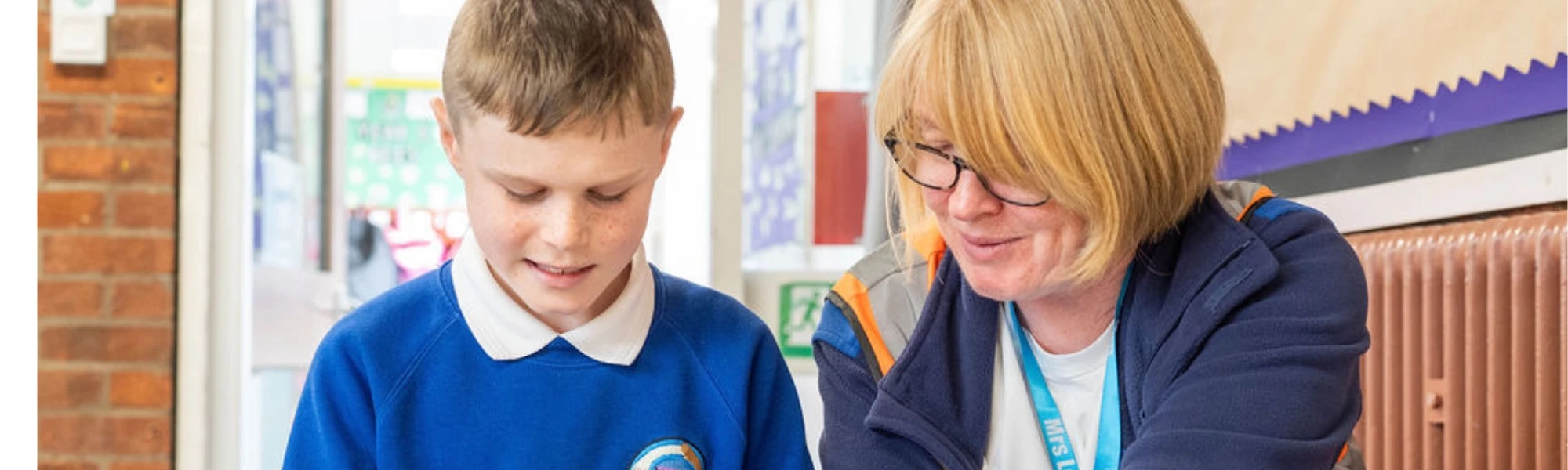 Teacher working 1:1 with pupil