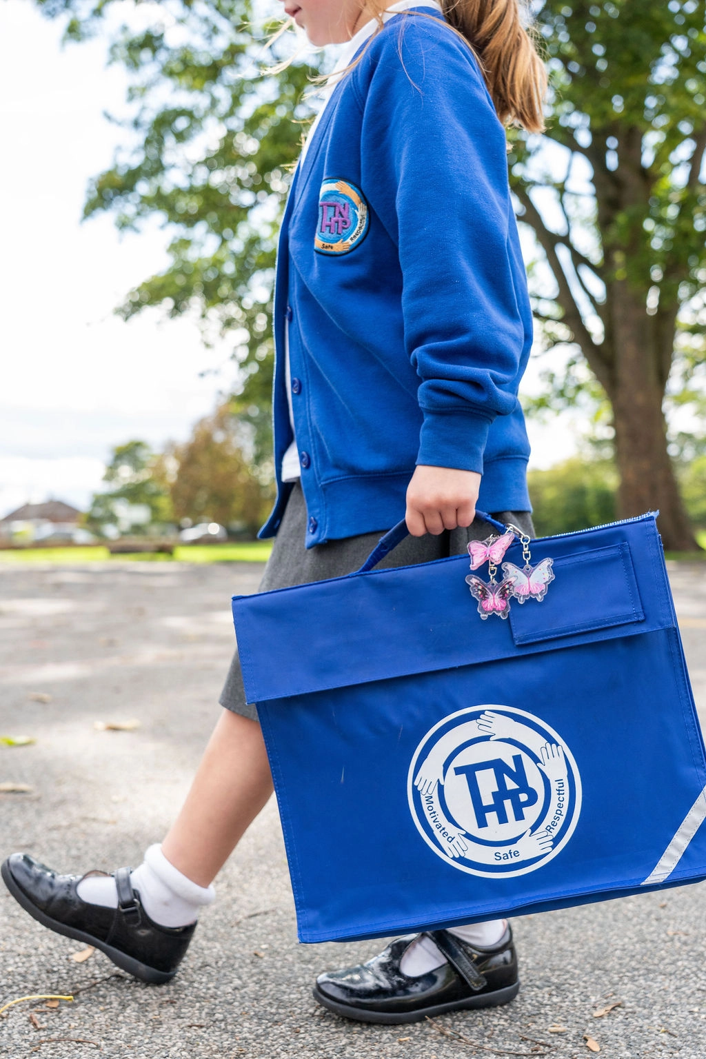 Child with a bookbag (portrait)